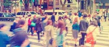 blurred image of people crossing the street in Tokyo